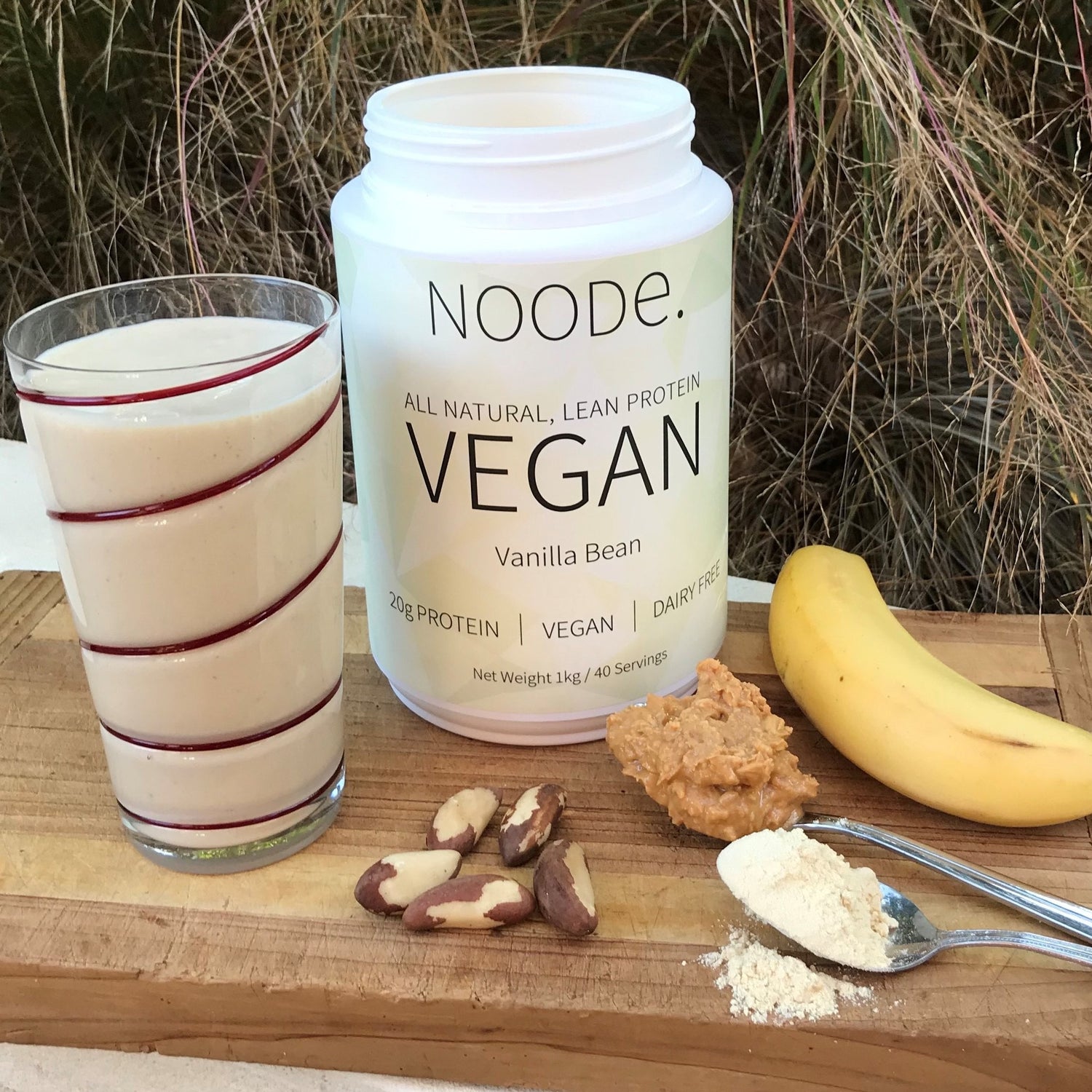 Pea Protein Smoothie with Nuts and Fruit on a chopping board